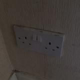 One phone socket, one double plug socket and a door
