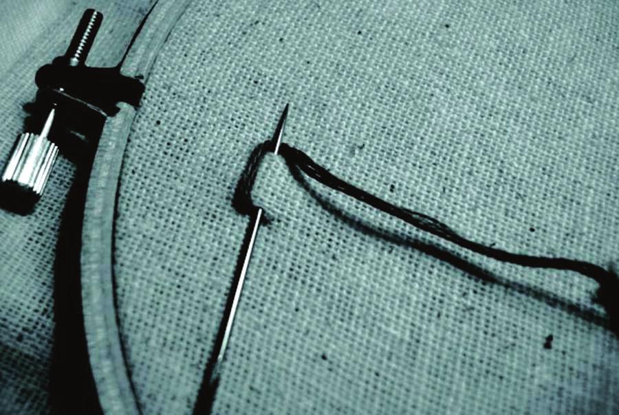 passed across in a slanting way with loop thread under the needle.