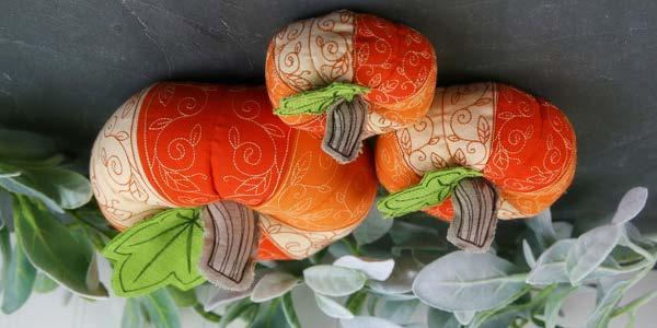 Pumpkin Patch Stuffie (In-the-Hoop) Welcome fall with a harvest of plush patchwork pumpkins! Just stitch each delicately decorated section in the hoop, then assemble and stuff.