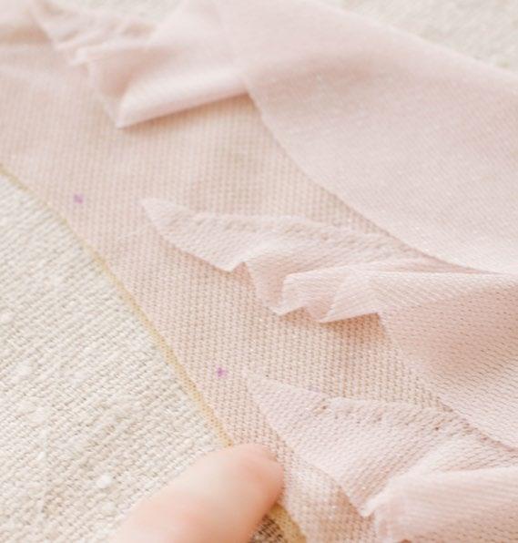 Then, with wrong side of flounces facing right side of back, sew together using a zigzag stitch that is approximately ¼ wide and aligns with the top edge of flounce.