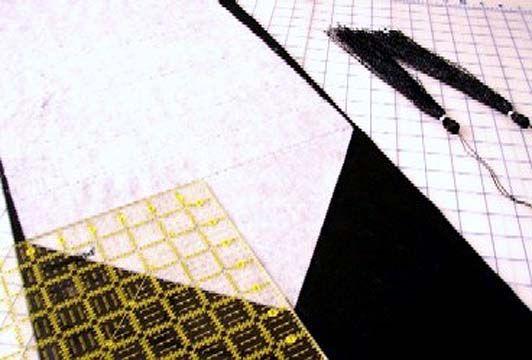 the fold of the fabric, cut off excess 6. Audition or lay your strips on background fabric to see how you like the placement.