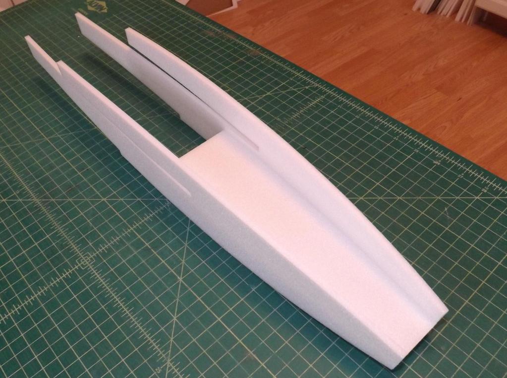 The battery tray is now glued to the fuselage sides, resting on the