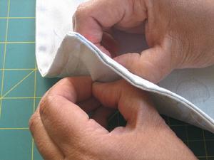 5. Make the gussets a) With your tote inside out, take one corner and open it up.