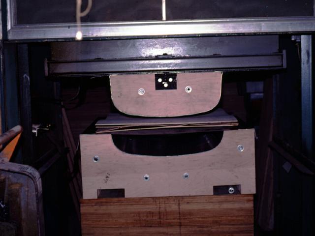 Once the molds have been placed in the press, a stack of veneers