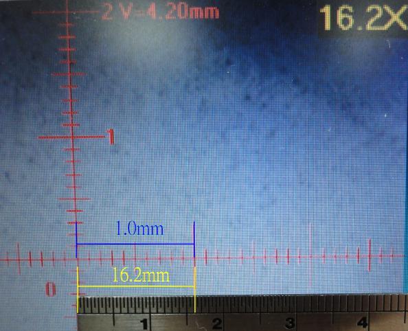 The magnification is calculated based on the Field of View, which already calibrated the horizontal and vertical scale. Users can put metal ruler on the screen to measure the size.