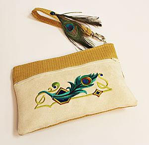 Finely Plumed Wristlet Wristlets are a convenient and handy-dandy way to carry around your essentials, whether you're taking a quick trip to the mall, or having a fancy night