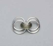 Separate the large rings into two pairs and place the large glass ring in between one of the pairs of