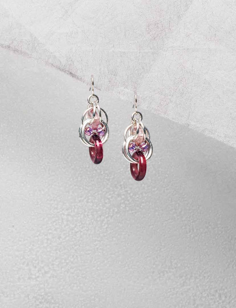 to the point earrings The small glass looks like it is floating inside the center of these earrings that form a defined point at the