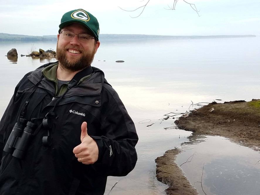 Nick poses with some Dunlin along the shores of Chequamegon Bay. numbers of shorebirds present, which also included Ruddy Turnstone, Dunlin, and Semipalmated Plover.