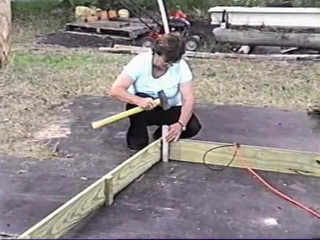 After installing the 1 5/8 inch ground stakes I leveled the wood frame then blocked the frame up where needed to keep it level.