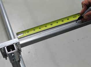 Move to one end support crossbar and measure 10" in from