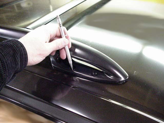 6. Mark holes, remove roof rack and center punch