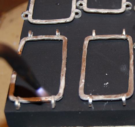 You ll solder four C-shaped jump rings to the outer edges of 12 rectangles. Place a C- shaped jump ring 5mm ( 3 16 in.) from each inside corner on each short side of a rectangle.
