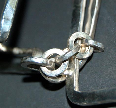 Use medium solder to solder the jump rings closed. Then, attach two three-link chains to make a six-link chain.