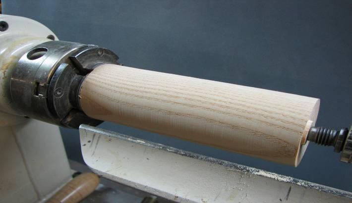 Making a 6 Peppermill Page 2 2. Mount the wood, tenon end, in a scroll chuck, bring up the tailstock and true the blank.