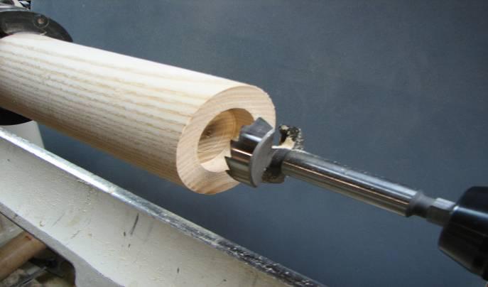 HINT1: Slow the lathe down to about 500 rpm. HINT2: To stop the forstner bit vibrating as it enters the wood, first tighten the tailstock spindle.