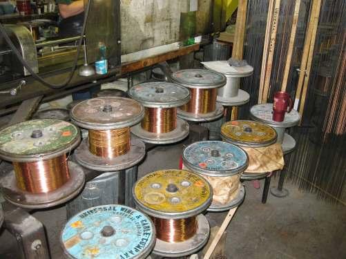 ) Strings vary as to the thickness of the steel core, the length and gauge of the copper windings, and the number of layers of windings.