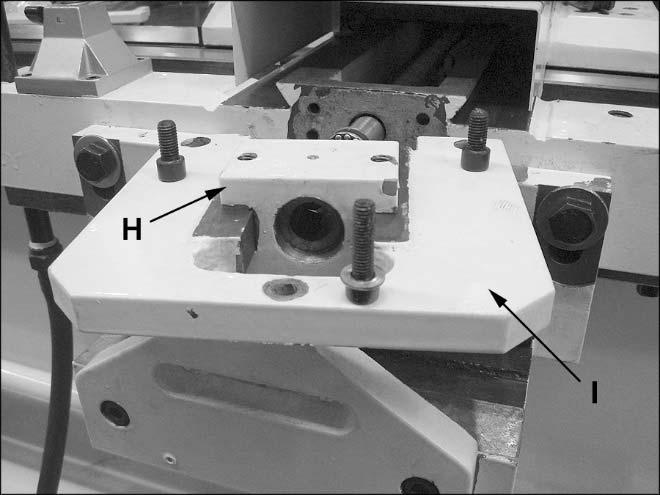 Remove two round nuts (A) and washer from end of cross-slide leadscrew (B). 6.
