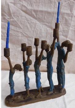 Chanukah Menorahs Ten Thousand Villages Add elegance to your Chanukah table with this bronze menorah.
