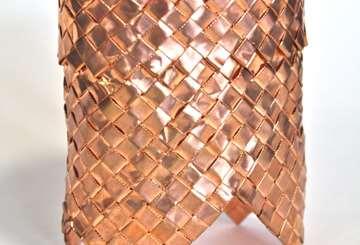 Copper Treasure sits on 4 feet and has a folded over rim. Done in ¼ weavers. Size 5.