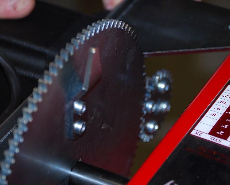 Tighten capscrews when the motor mount is pressed firmly against the headstock.