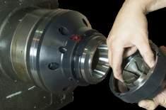 Workpiece remains in a fixed position during actuation allowing for precise z-axis positioning.