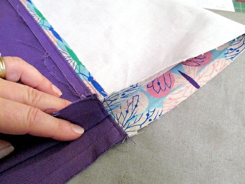 9. With the seams aligned, pin along the bottom of the tube. 10. Using a ½ seam allowance, stitch across the bottom of the tube. 11.