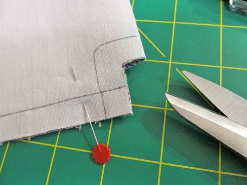 14. Flatten the corner with the seam at the exact center, and