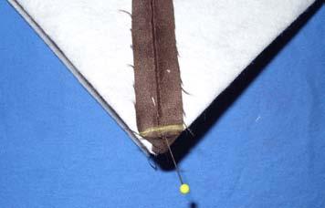To form a gusset in the bottom of the bag, on each side of the bag, line up the side seam with the center bottom of the bag, forming a triangle.
