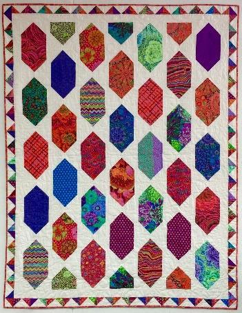 Make rectangle snowball blocks and your pieced border all at the same time. Easy Street is the perfect name for this fun and easy quilt.