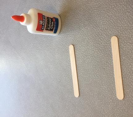 Little Hut: Using non-toxic school glue and tongue depressors you can make a fun