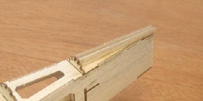 Place a scrap of 1/8 balsa sheet between them to maintain the proper spacing.