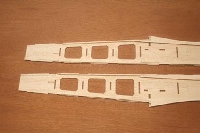 Be sure to make a right hand and a left hand side. 12...Glue two 3/32 sq. X 18 stringers to the inside of each fuselage side. One is on the top and one is on the bottom.