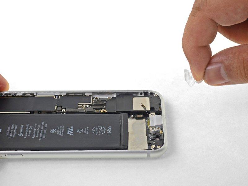 Slowly pull one battery adhesive tab away from the battery, towards the bottom of the iphone.