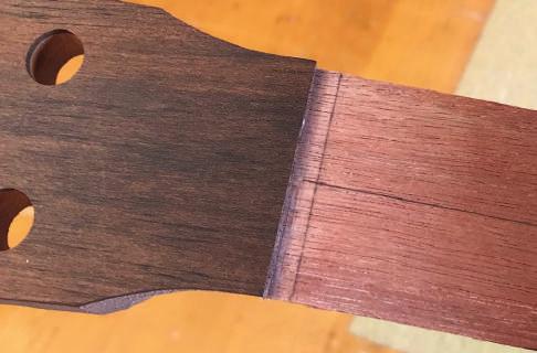 (It s not necessary to glue the material in if it fits snugly in the hole.) Now repeat the process between the 10th and 11th fret.