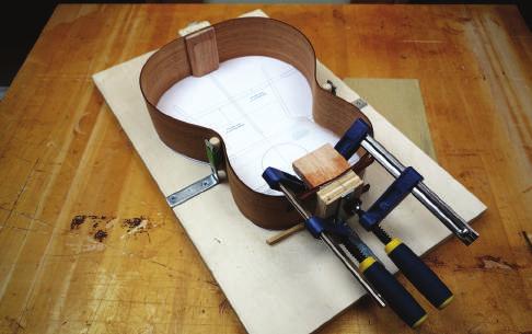 Using even more, closely spaced together, ensures that the linings are pressed to the sides at every point along the curves. The linings are oversized and will need to be trimmed before glue up.