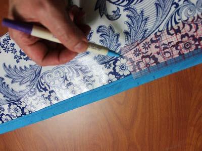 Using an air-erase pen, mark 8 1/2" in along the top edge of the bias tape starting at each top