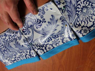 Pinch and fold the fabric to make pleats by bringing the outer marks in to meet the center marks as