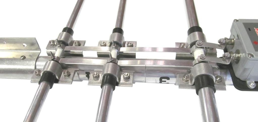 Open the two studded band clamps and place them around the antenna boom as shown below.