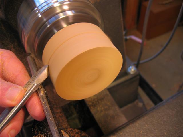 5. Chuck up the body of the box. True up the side and end using a spindle gouge. Use a parting tool or beading/parting tool to cut the flange upon which the lid will fit.