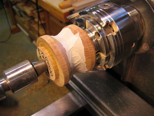With a spindle gouge form a shallow cove centered on the join between the lid and the bottom of the box.