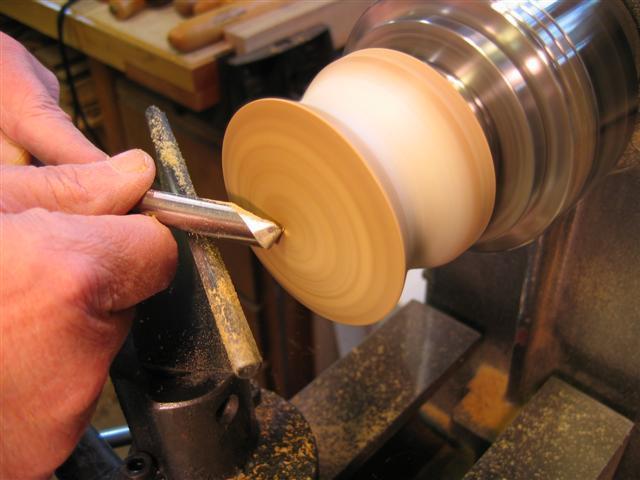 Remove the tailstock and if the jam fit is not perfect secure the top to the bottom with masking tape in the cove.