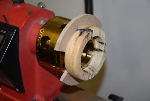 choosing. You can also use a four jaw chuck with a set of mini jumbo jaws and use a hole saw to make the blank.