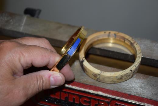 11) Now use the brass bushing core and place a small piece of masking or duct tape on