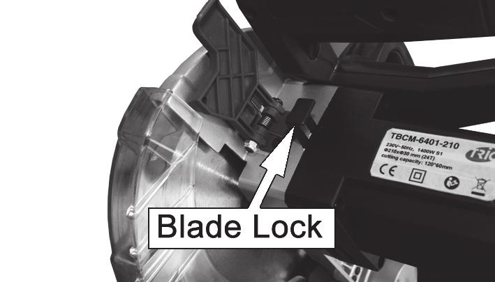 With the saw head in the raised position, move the blade guard release to allow the blade guard to be rotated to allow access to the centre screw. 2. Push and hold down the blade lock.