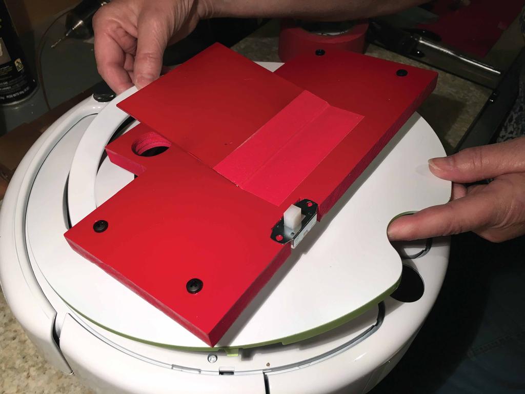 IGNORE RED TAPE FIGURE 18 20. Install the top plate assembly onto the Create 2. Be sure the raise the Create 2 carrying handle as you slide the assembly into place.