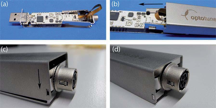 USB stick (b) until the front side clips fit in the openings of the cover.