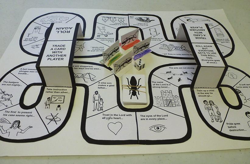 the pictures Optional: sheet of poster board to which you can glue the track How to assemble the game: 1) Cut out the track sections, including the two bridge pieces and glue together as shown in the