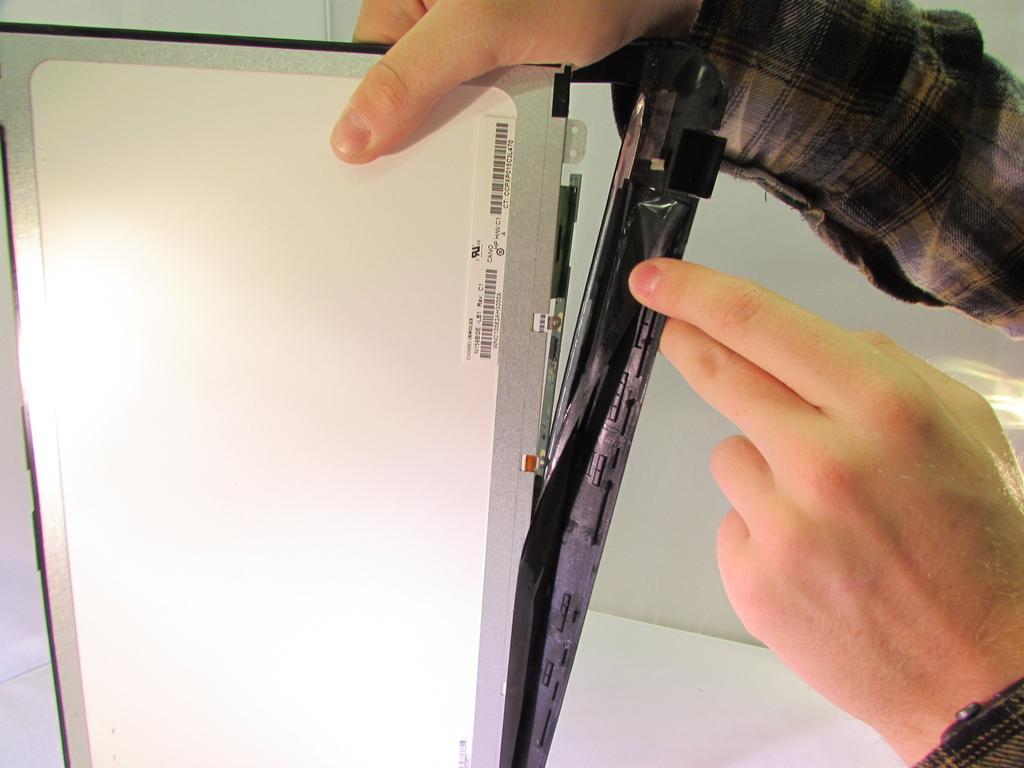 Step 25 Pull the black tape that is attached to the frame off of the screen To reassemble your device, follow these