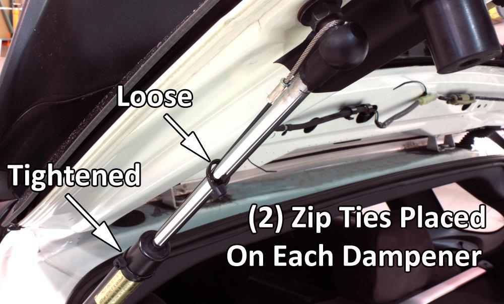 One zip tie gets installed around body of shock and tightened. The second zip tie gets installed loose around shaft of the hydraulic dampener.